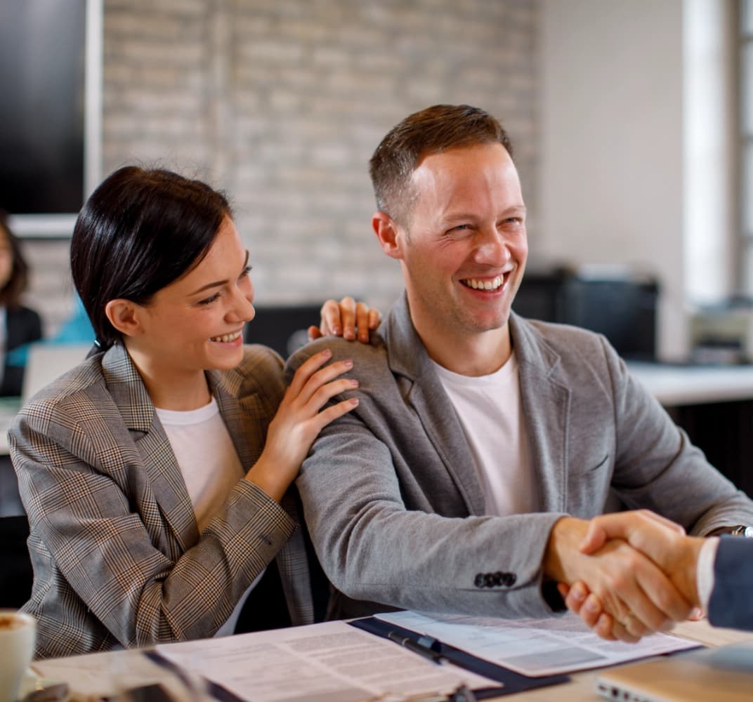 man smiling and shaking hands